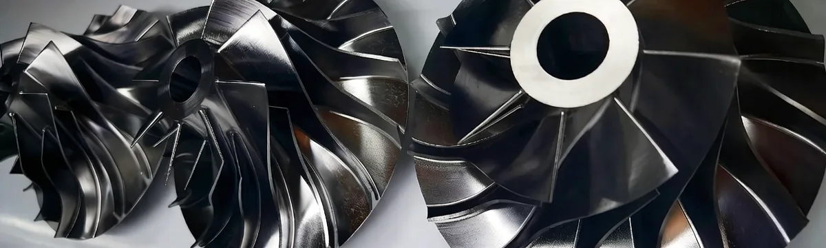 Two completed turbine wheel prototypes side by side